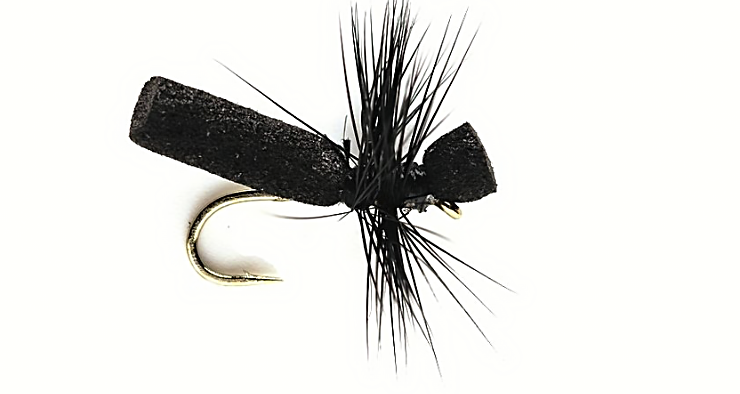 Black hi-float foam ant trout fly tied on a gold hook